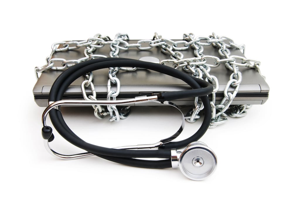 medicus it chain wrapped around laptop with a stethoscope Cybersecurity for Healthcare