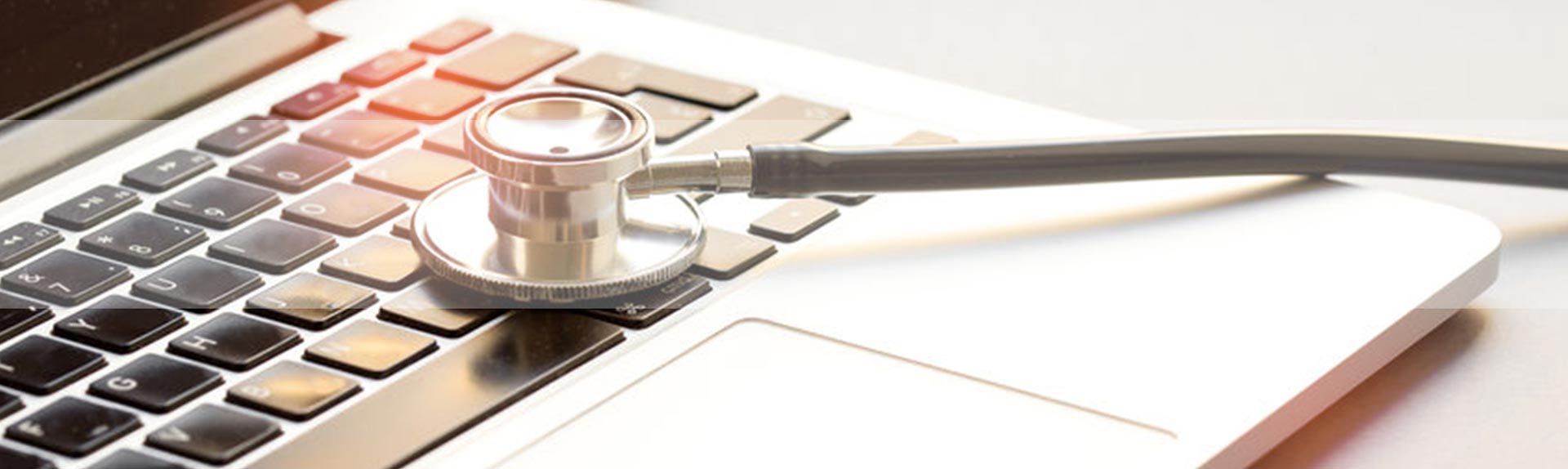 medicus it staff augmentation stethoscope on laptop