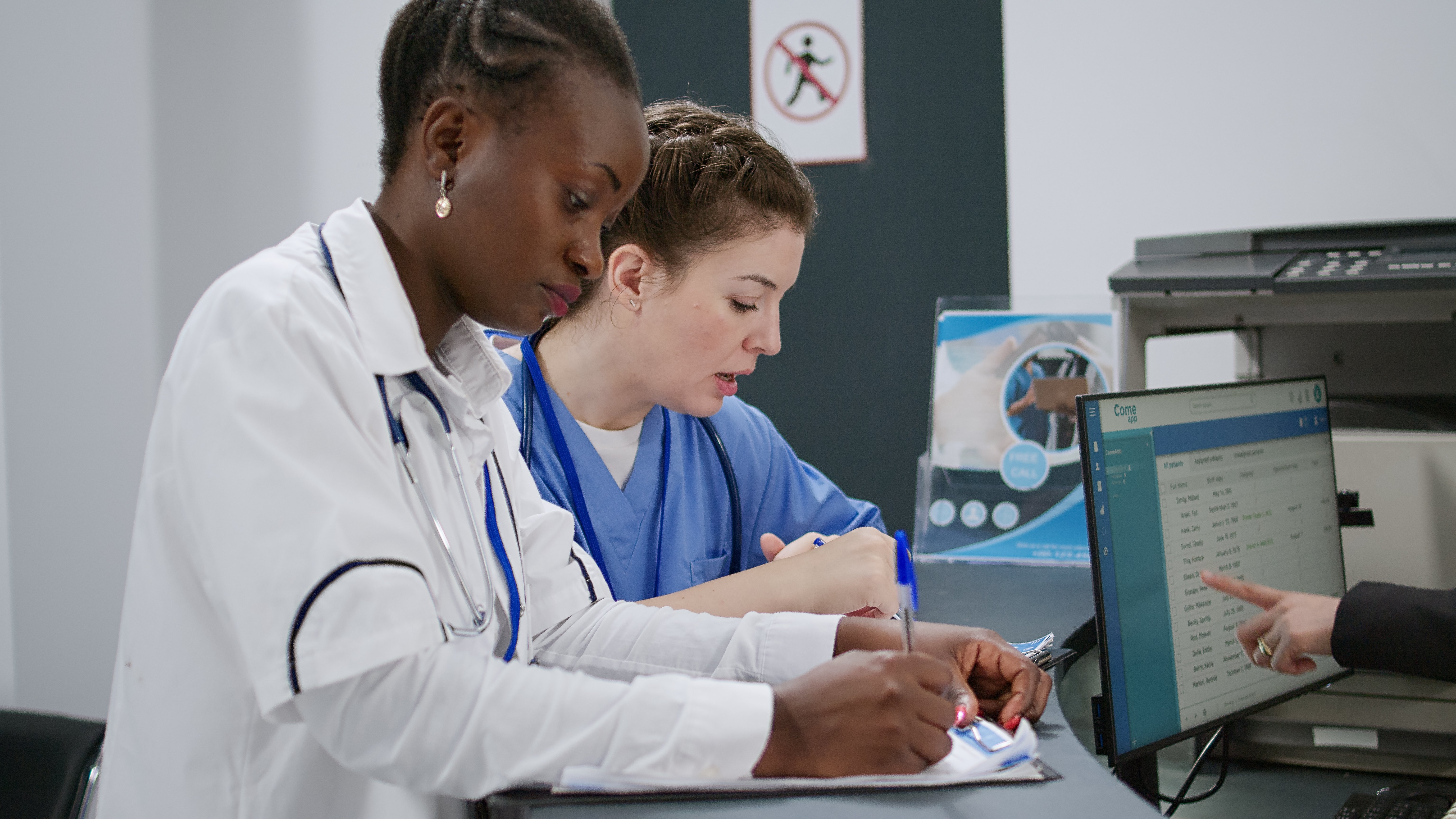 multiethnic-team-specialists-analyzing-report-papers-hospital-reception-desk-lobby-helping-people-with-appointments-doctor-nurse-using-medical-forms-with-checkup-handheld-shot multiethnic-team-specialists-analyzing-report-papers-hospital-reception-desk-lobby-helping-people-with-appointments-doctor-nurse-using-medical-forms-with-checkup-handheld-shot